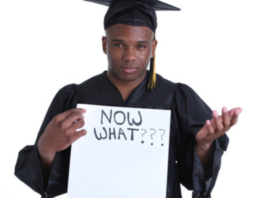 A Graduate Student with a placard : " Now what" sign